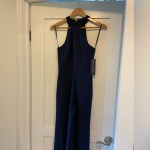 Rachel Roy navy blue cross across halter neck jump suit.